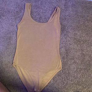 A tan bodysuit